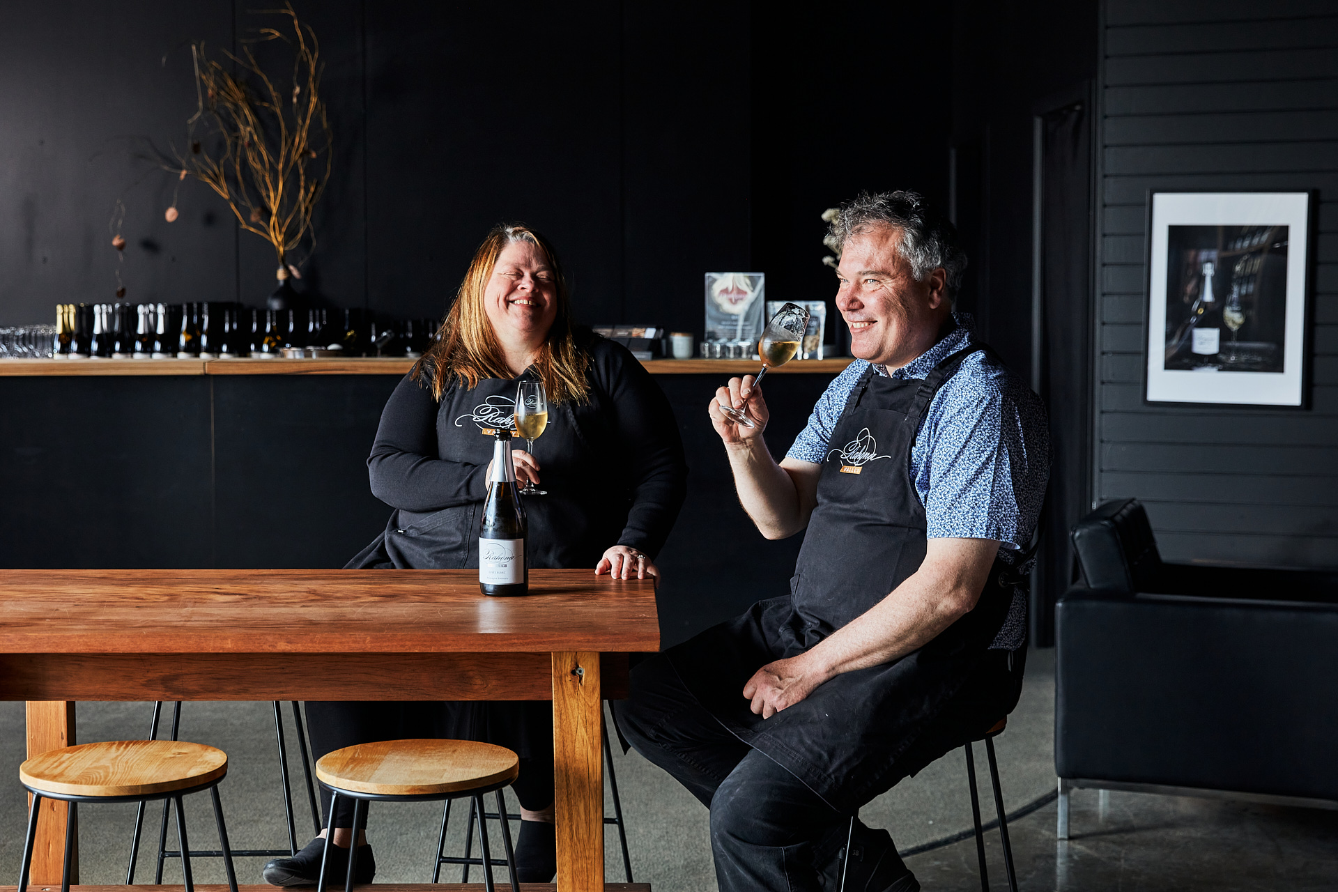 A man and woman enjoying wine 
